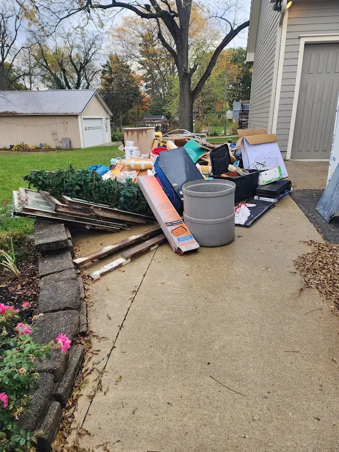 Dumpster being loaded with debris for Commercial Dumpster Rental in Harbison Canyon